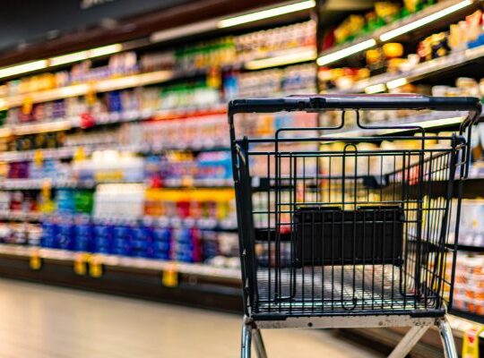 Retail buyer assessing shelf layout and product placement