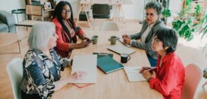 Small business owner pitching a product to a retail buyer across a table