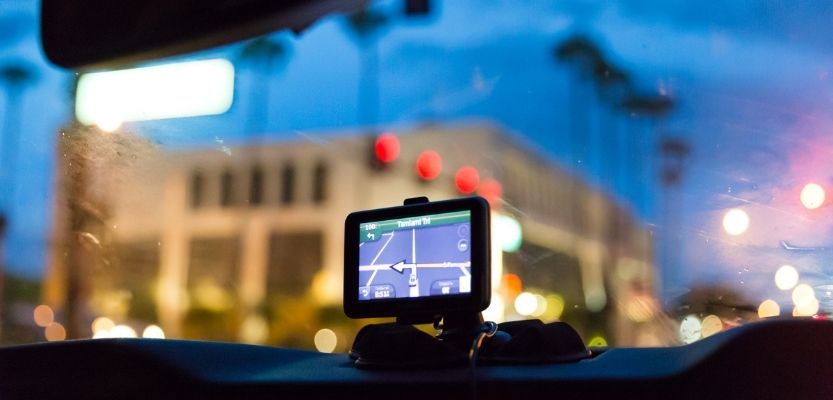 Sat nav recalculating route to represent reviewing your marketing direction.