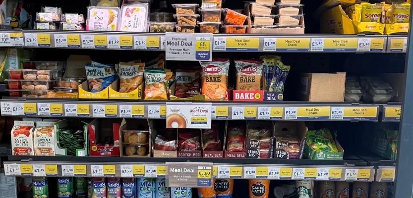 Tesco meal deal fixture showing mains, sides and drinks with clear navigation and clubcard pricing.