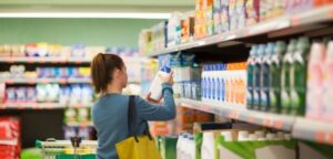 Shopper viewing a branded retail display illustrating enhanced retail experiences for 2026.