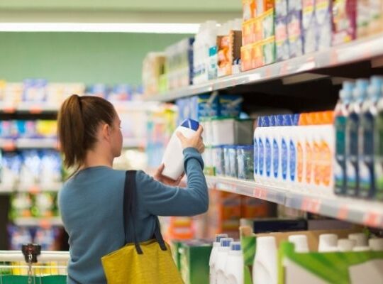 Shopper viewing a branded retail display illustrating enhanced retail experiences for 2026.