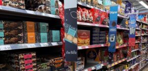 Retail shelves filled with Christmas food products highlighting brand visibility