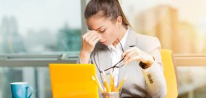 Small business owner feeling overwhelmed and stuck with marketing tasks