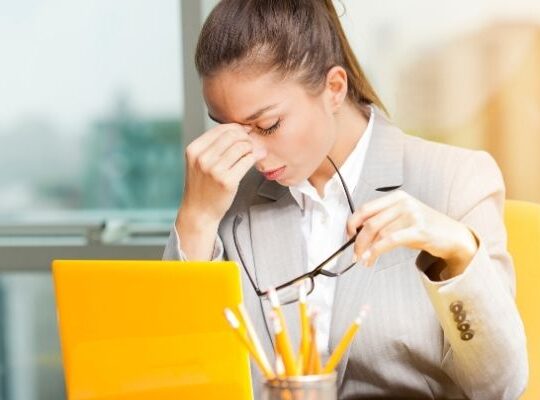 Small business owner feeling overwhelmed and stuck with marketing tasks