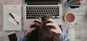 Business owner stressed by marketing feeling overwhelmed and distracted