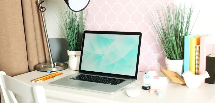 Calm workspace with tea and notebook representing reduced mental load and organised marketing