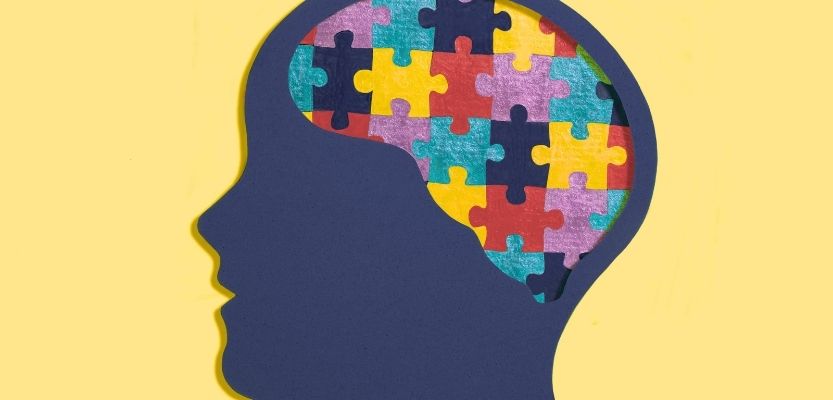 Business owner brain filled by jigsaw pieces representing marketing ideas and notes feeling overwhelmed and distracted