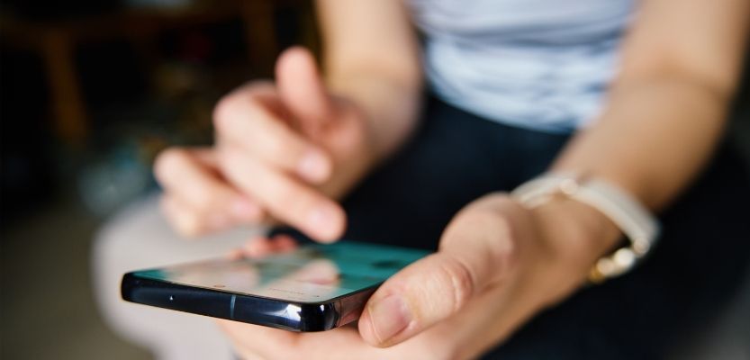 A person scrolling on social media.